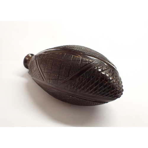 187 - A carved coquilla nut Flask, 5 1/2in