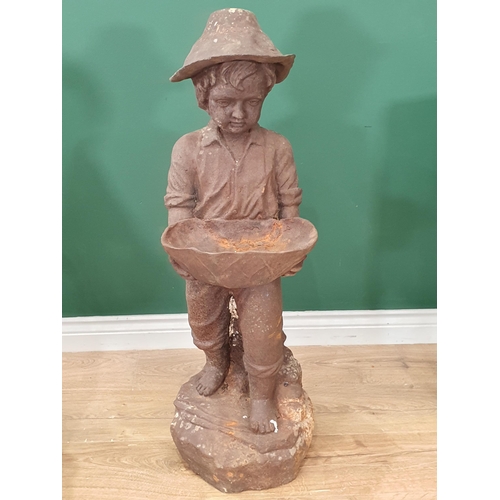 19 - An antique cast iron Figure of a young boy wearing a hat and holding a bowl, 3ft 1in H