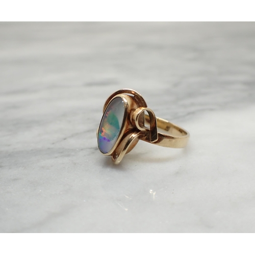 190 - An Opal doublet Ring rubover-set oval stone, stamped 9ct, approx 2.70gms, ring size G