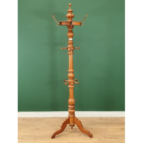 20 - A 19th Century turned Beech Coat/Hat Stand, the top with turned finial above six brass coat hooks, a... 