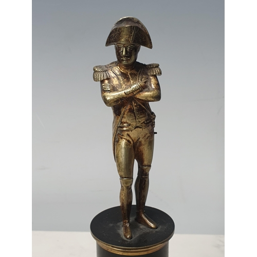 203 - A bronzed Figure of Napoleon standing arms crossed on a plinth with brass mounts, 9in H