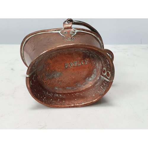 204 - A miniature copper Coal Scuttle with swing handle and stamped S Welch to base, 3 1/2in H