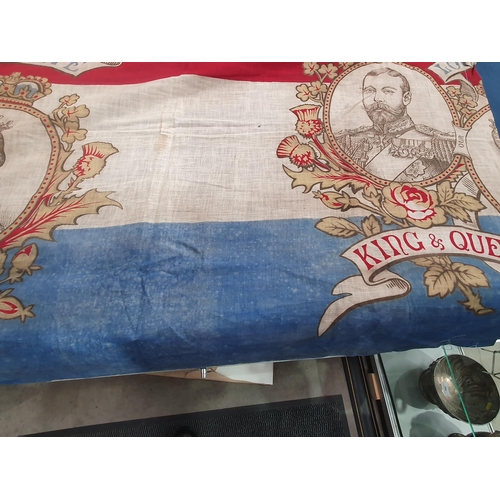 206 - A Coronation Flag/Banner depicting King George V and Queen Mary, small hole and some staining, 29 x ... 