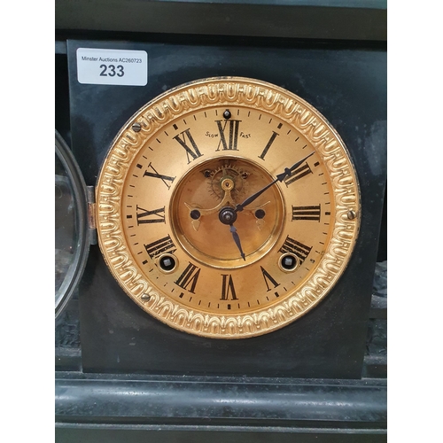 233 - A black slate Mantel Clock with gilt dial, flanked by figures with horses and columns, with French s... 