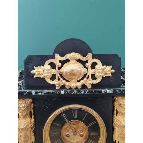 235 - A slate and variegated marble Mantel Clock with French striking movement, applied metal mounts unatt... 