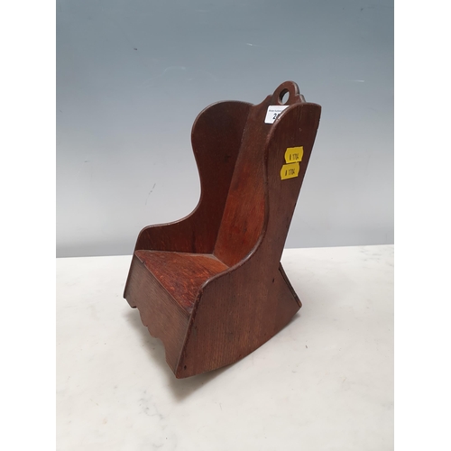 240 - An oak Dolls Rocking Chair with shaped sides and top rail, 9