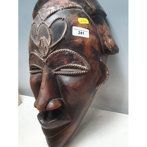 241 - An ethnic carved Tribal Mask with applied metal and wirework decoration, A/F, 16