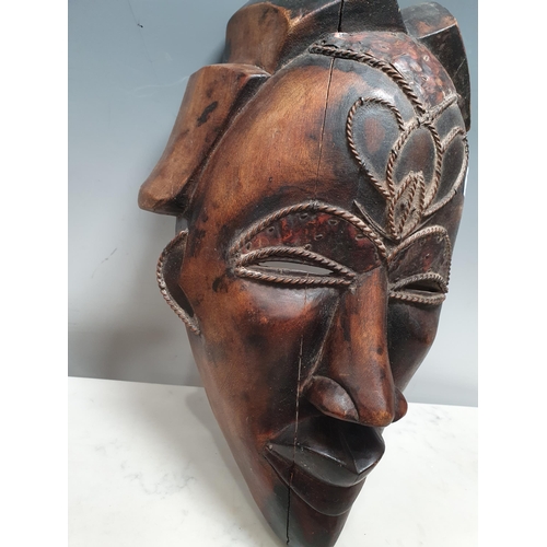 241 - An ethnic carved Tribal Mask with applied metal and wirework decoration, A/F, 16