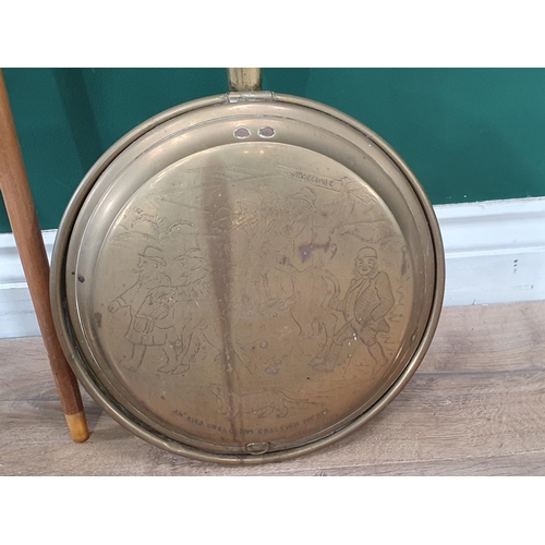 250 - A folding brass Tray Top Table, an oval brass Tray, a Warming Pan, and two Walking Sticks.