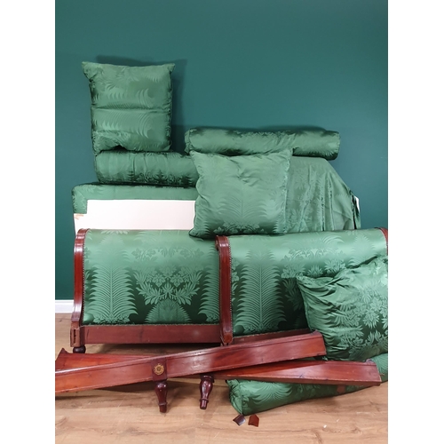 264 - A French style Day Bed with scrolled ends, floral green upholstery, the side rails mounted with bras... 