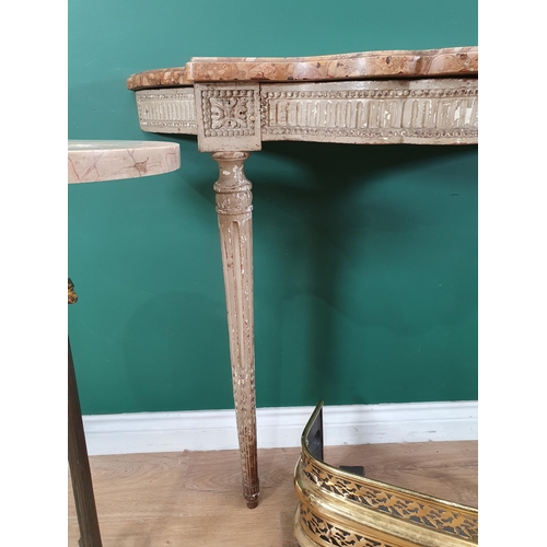 266 - An antique pierced brass Fender, 3ft 5in W, a marble top Wine Table with griffin support on the flut... 