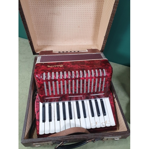 275 - A Galotta cased Accordion and a Genuine Piano Action Italian Model Steel Bronze Reeds.