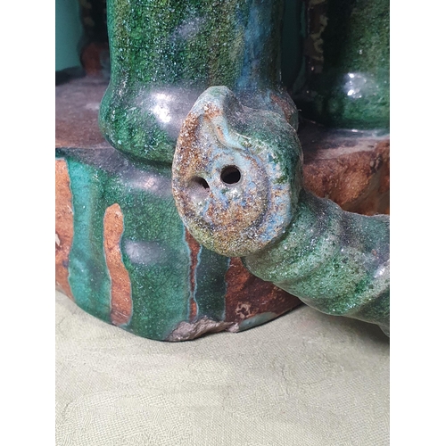 287 - A pair of green and blue glazed pottery Elephant Seats with floral decorated saddles, (the word Chin... 