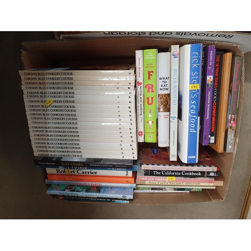 318 - Two boxes of books including various cookery books