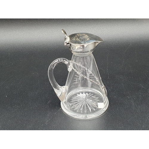 36 - An Edward VII silver mounted and lidded cut glass Toddy Flask, Birmingham 1907, and a Whisky Label, ... 