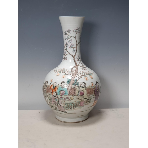 378 - A large Chines Vase decorated figures in an exterior scene sat at and stood beside a table and with ... 