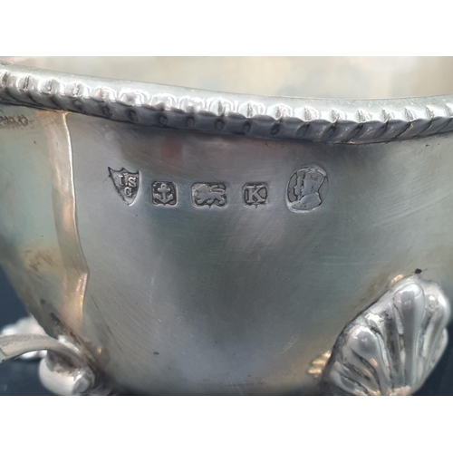 39 - A George V silver Sauce Boat with beaded rims, engraved initials on three shell feet, Birmingham 193... 