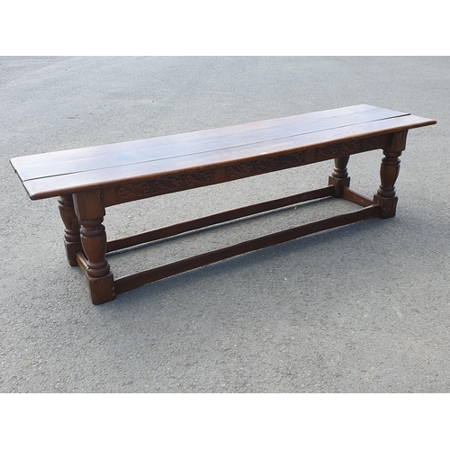 471 - A Large Oak Refectory table with carvings to the side fitted stretchers on all sides, 2ft 7