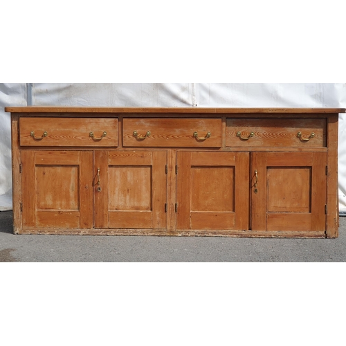 472 - A large Pitch Pine kitchen unit fitted three large drawers above four cupboard doors H3ft 3