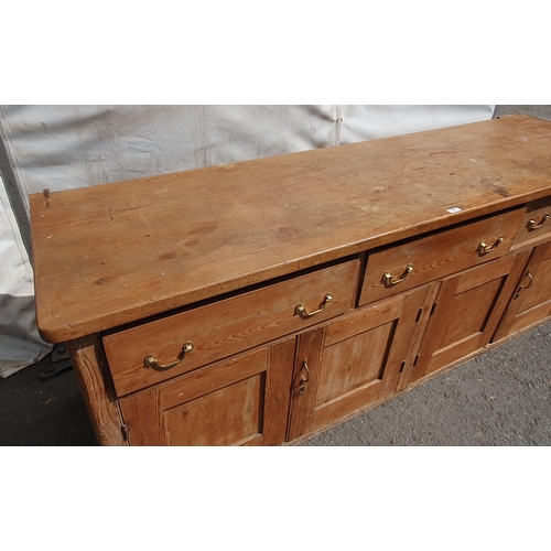 472 - A large Pitch Pine kitchen unit fitted three large drawers above four cupboard doors H3ft 3