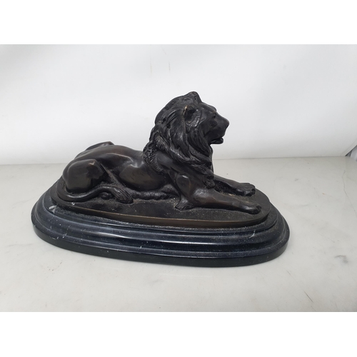 50 - After BARRIE, a pair of bronze Recumbent Lions on oval bases