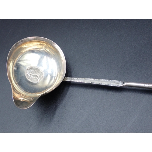 53 - A George III Punch Ladle with coin inset silver bowl and spiral whalebone handle, London 1792