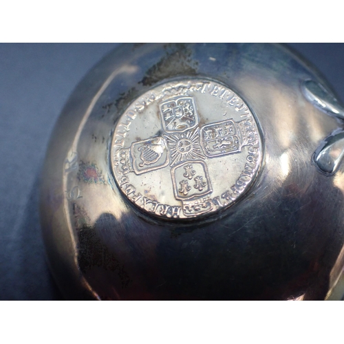 53 - A George III Punch Ladle with coin inset silver bowl and spiral whalebone handle, London 1792