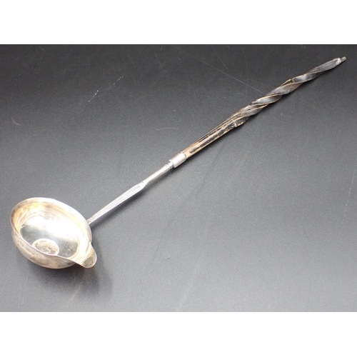 53 - A George III Punch Ladle with coin inset silver bowl and spiral whalebone handle, London 1792