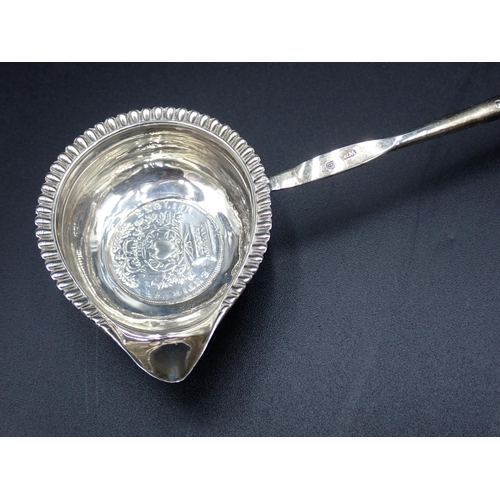 54 - A George IV Punch Ladle with coin inset silver bowl, gadroon rim and spiral whalebone handle, London... 