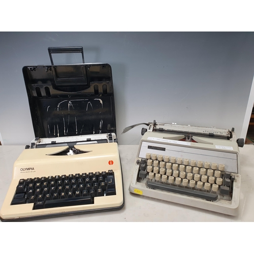 571 - An Alder Gabriele 25 Typewriter c.1968 and an Olympia Monica electric deluxe portable Typewriter