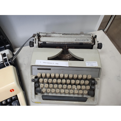 571 - An Alder Gabriele 25 Typewriter c.1968 and an Olympia Monica electric deluxe portable Typewriter