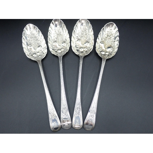 58 - Four George III silver Berry Spoons with fruit embossed bowls, decorative stems engraved crowned K c... 