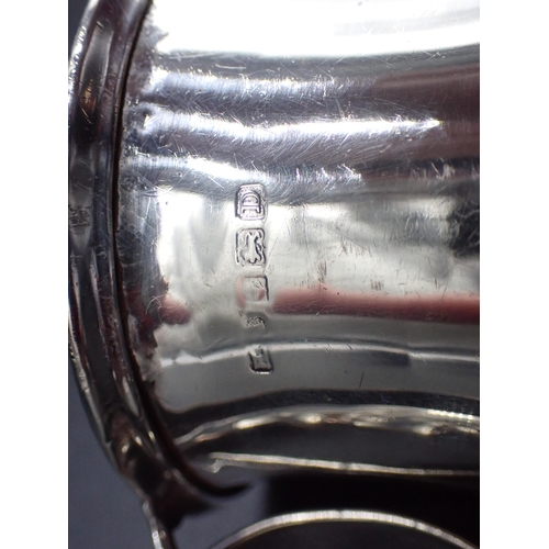 63 - A George V silver Christening Mug of waisted form with man-in-the-moon handle, Birmingham 1928, and ... 