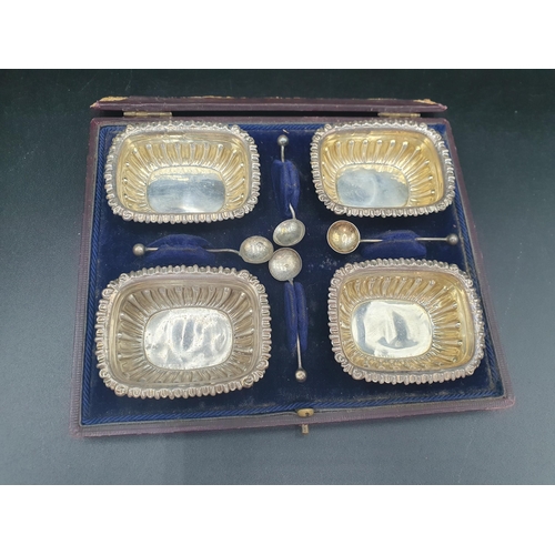 67 - Four Victorian silver Salts of rectangular form, and Spoons, Birmingham 1899, in case, a silver Butt... 