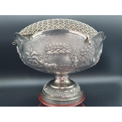 68 - An Indian silver Rose Bowl with four panels chased with figures in country pursuits, presentation in... 