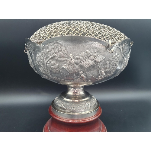 68 - An Indian silver Rose Bowl with four panels chased with figures in country pursuits, presentation in... 