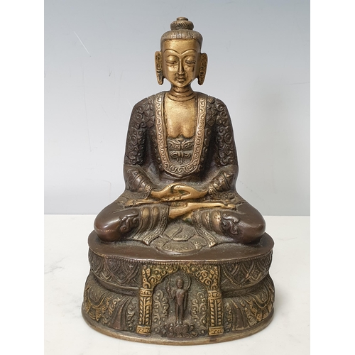 7 - A patinated bronze Seated Buddha, 7