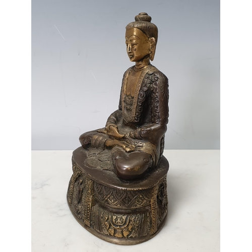 7 - A patinated bronze Seated Buddha, 7