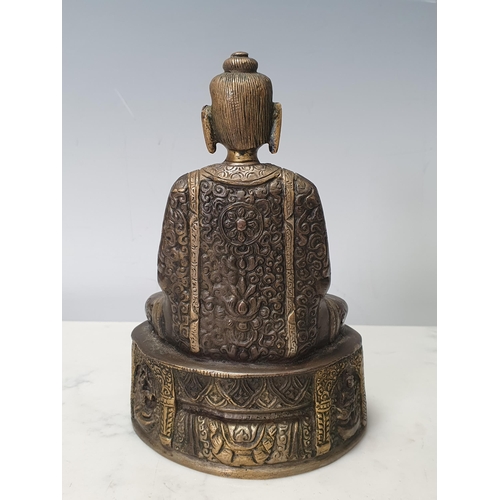 7 - A patinated bronze Seated Buddha, 7