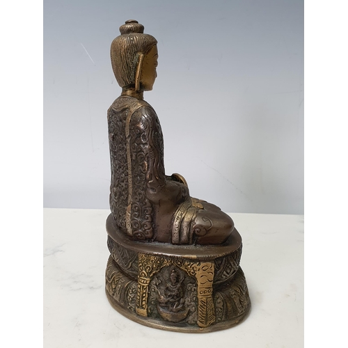 7 - A patinated bronze Seated Buddha, 7