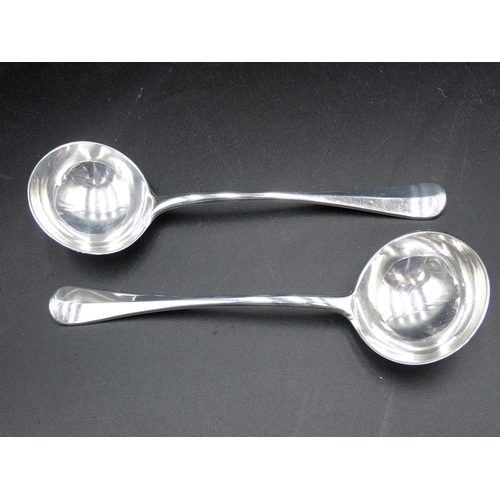 75 - A pair of Victorian silver Sauce Ladles, hanoverian pattern, engraved crests, rat tail bowls, London... 