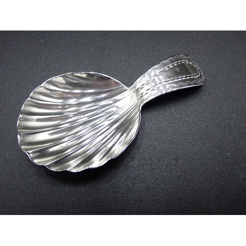 78 - A George III silver Caddy Spoon with scallop bowl and bright cut stem, London 1792, maker: G.W.