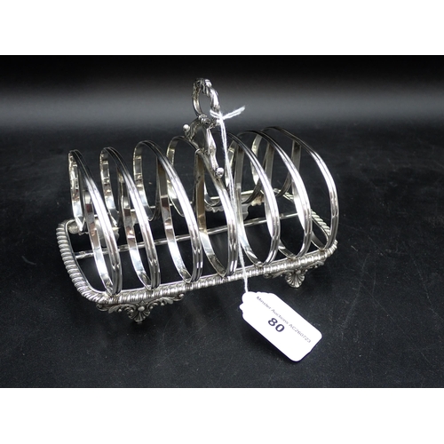 80 - A William IV large silver seven bar Toastrack with central leafage scroll handle, engraved initials,... 