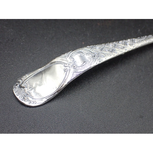 84 - A George III silver Sifting Spoon with fruit embossed bowl, trellis pattern stem with vacant cartouc... 