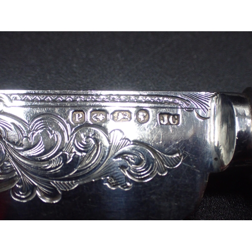 87 - A Victorian serving Knife and Fork with finely scroll engraved silver blades with Mother of Pearl ha... 