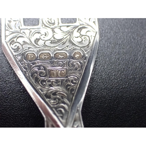 87 - A Victorian serving Knife and Fork with finely scroll engraved silver blades with Mother of Pearl ha... 