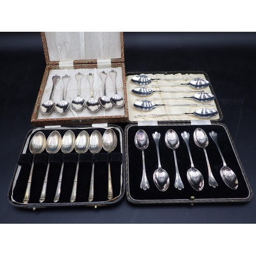 88 - Three Sets of six silver Coffee Spoons, two with trefid finials and rat tail bowls, London 1897, She... 