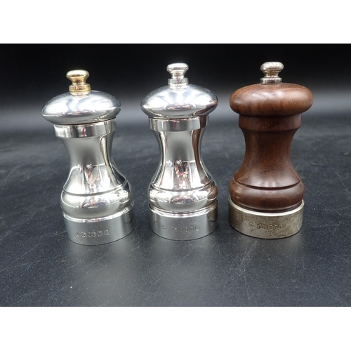 89 - Two modern silver Pepper Mills, London 2001/2, both boxed, and a silver mounted Pepper Mill, London ... 