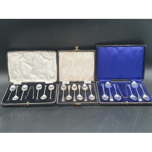 92 - Three sets of six silver Coffee Spoons, two with tongs and cased