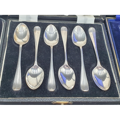 92 - Three sets of six silver Coffee Spoons, two with tongs and cased